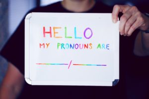 Whiteboard sign reading Hello my pronouns are followed by a blank line