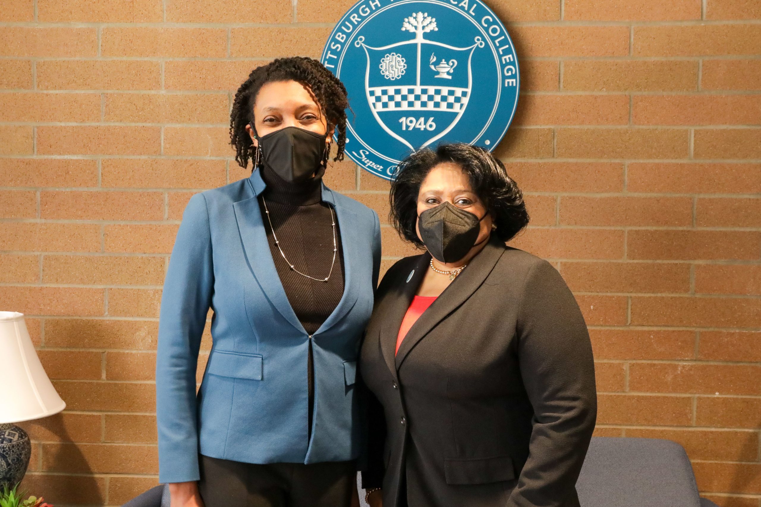 Dr. Harvey-Smith standing with a represenative from Sustainable Pittsburgh