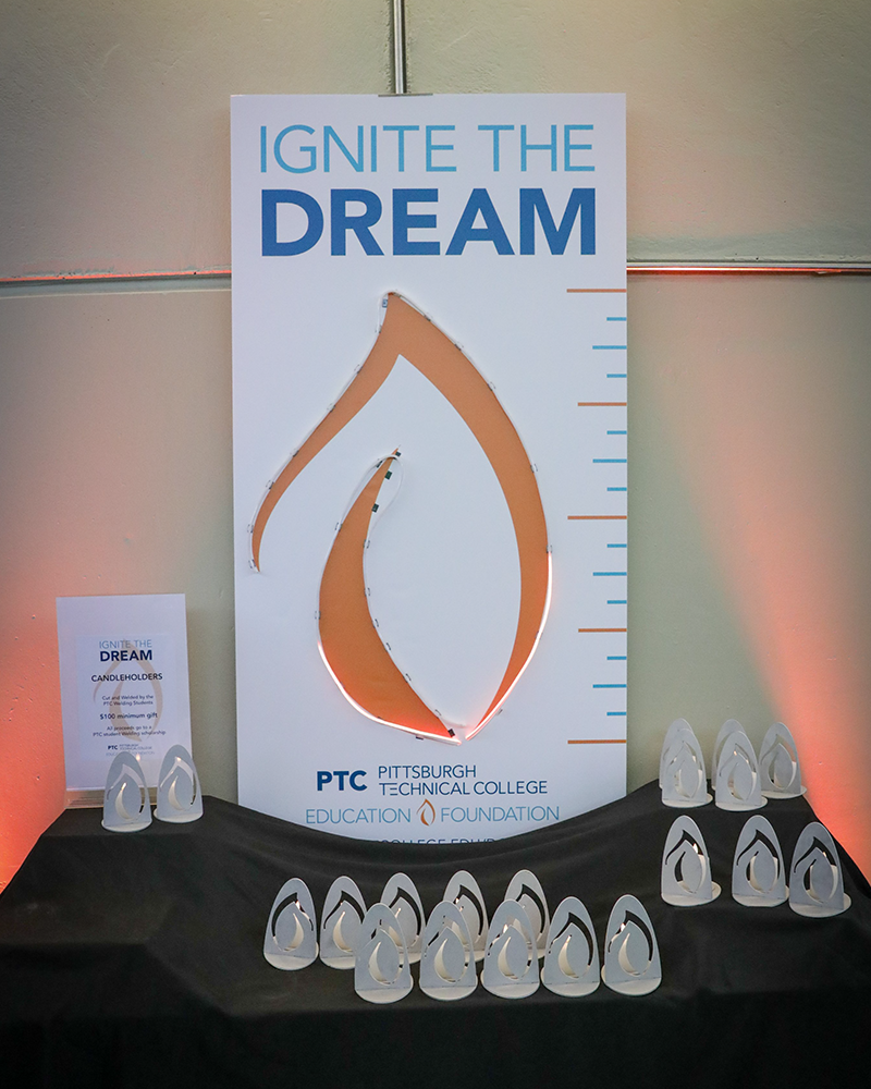 A photo of the Education Foundation flame display piece.