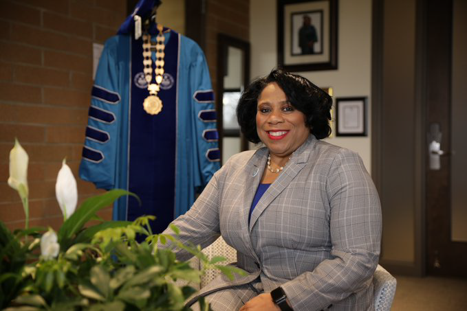 A photo of Dr. Alicia B Harvey-Smith sitting in her office.