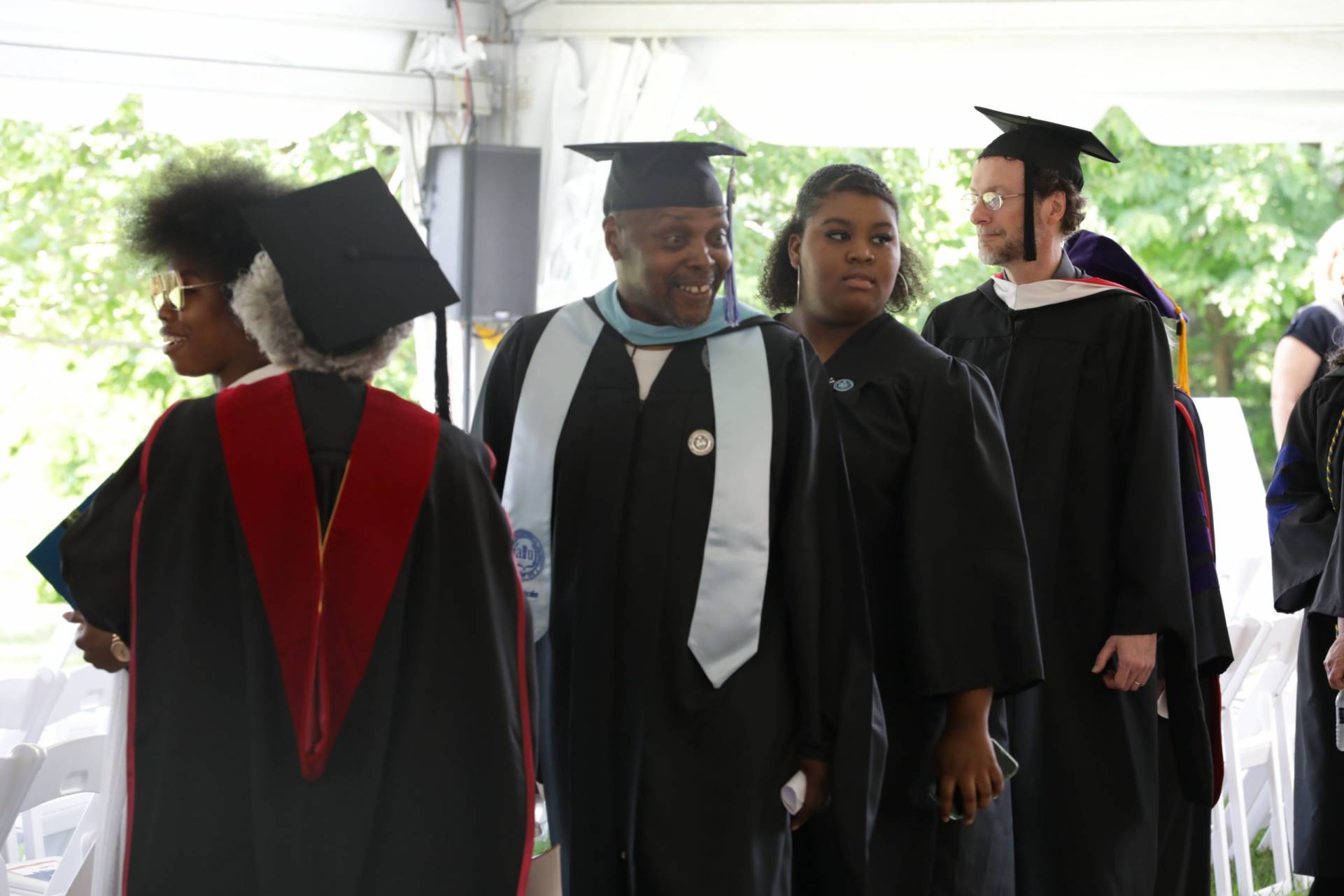 Faculty and Staff members walking for the Installation of Dr. Harvey-Smith.