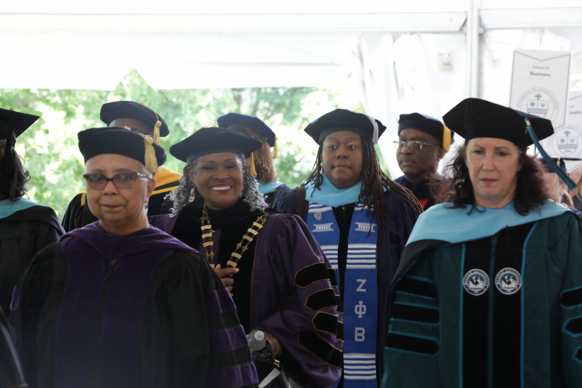 Members of the procession walking for the Installation of Dr. Harvey-Smith.