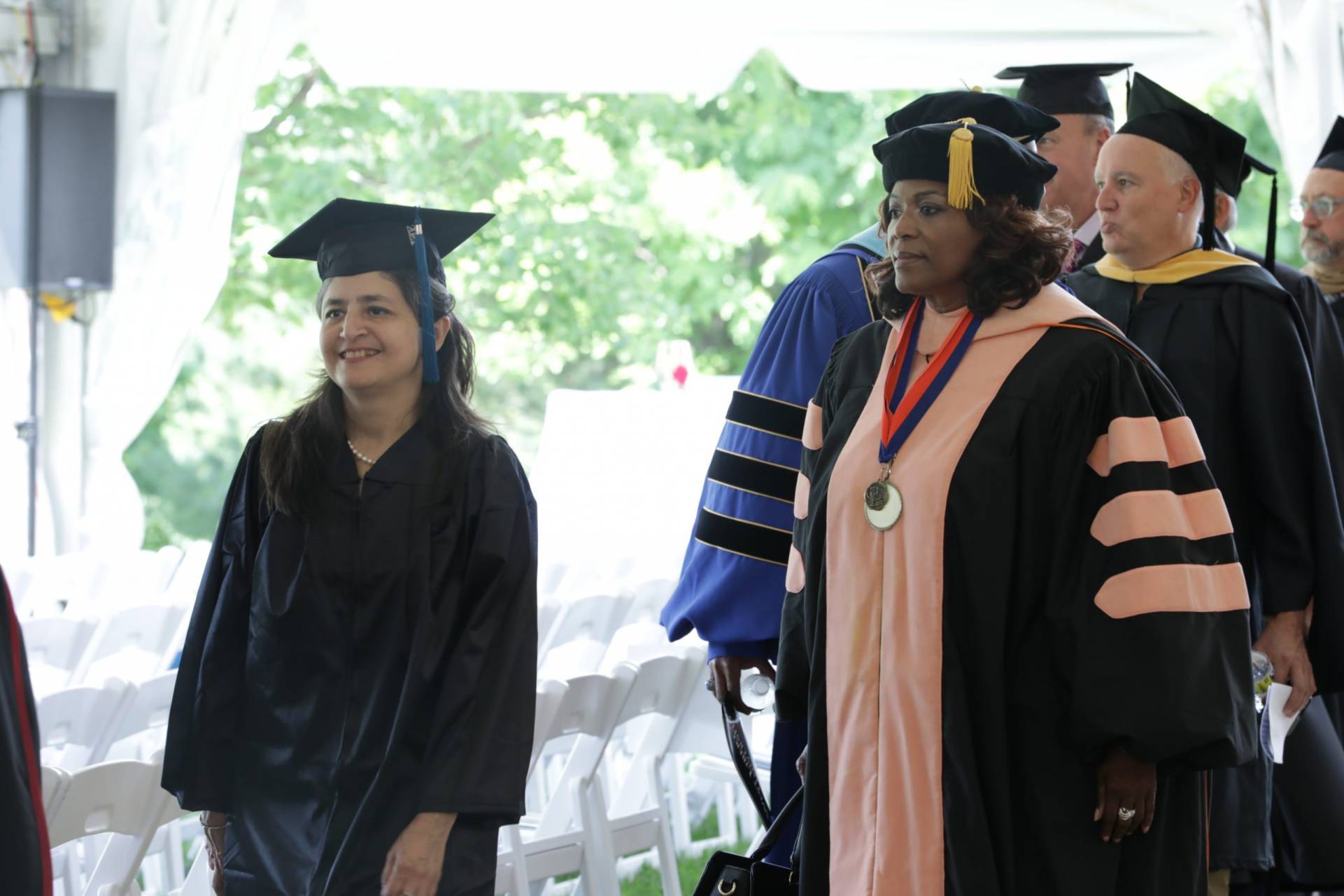 Faculty and Staff walking in the procession for the Installation of Dr. Harvey-Smith.