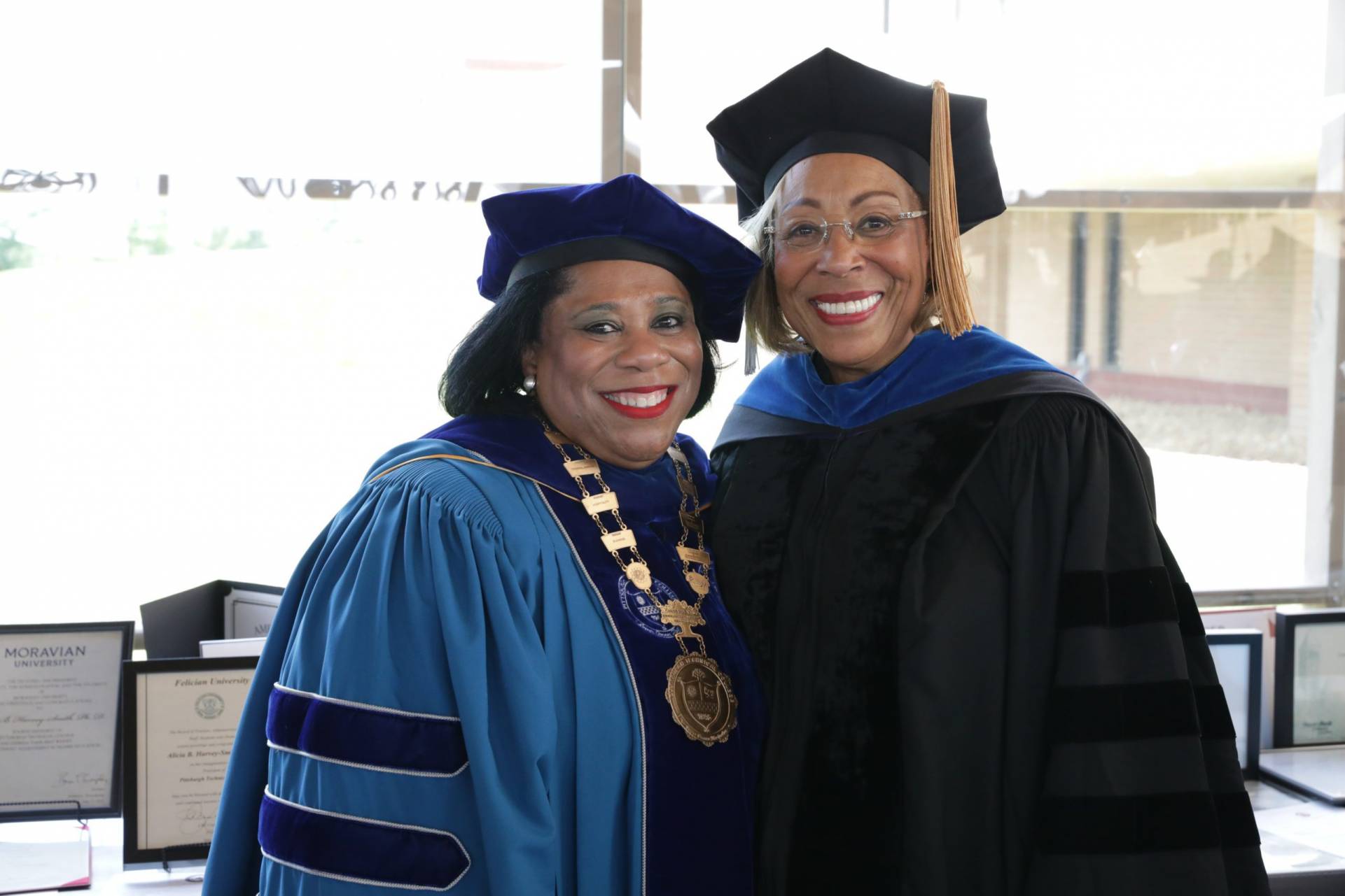 A photo of Dr. Harvey-Smith posing with a guest from the Installation Ceremony.